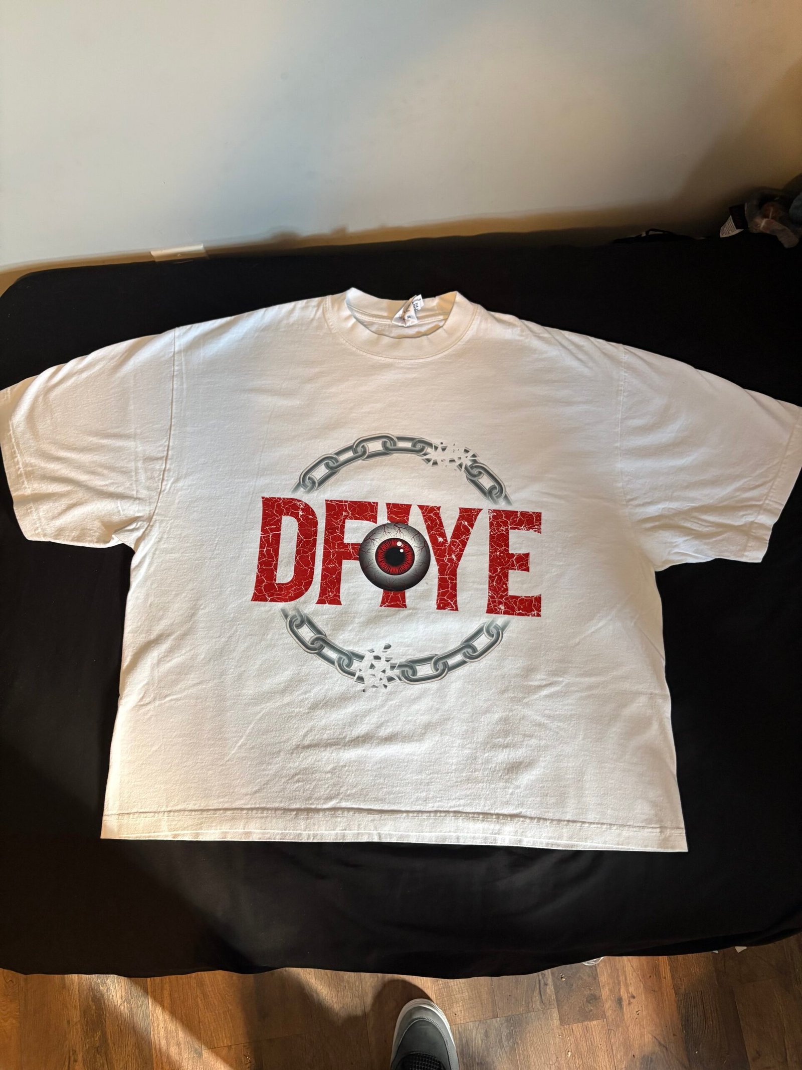 DFIYE Limitless Signature Tee with the DFIYE eye emblem.